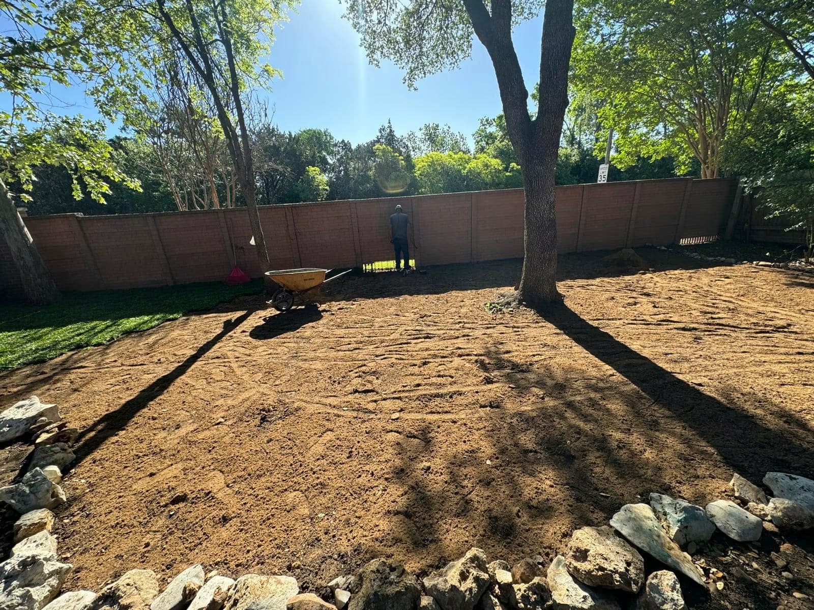 Residential backyard during grading and soil preparation